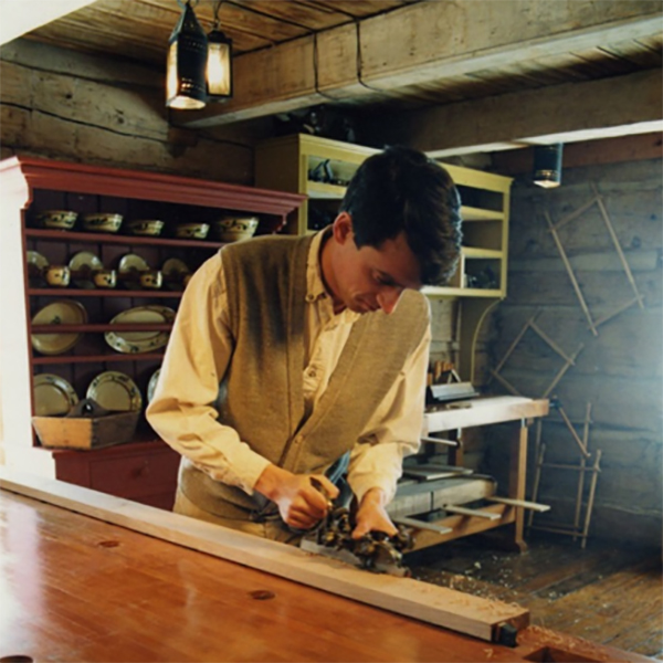 A museum interpreter demonstrating wood planing in 1991. Source: Civic Collection